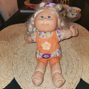 Cabbage Patch Kids Magic Glow Surprise Blonde Curly Hair Doll with Orange Outfit